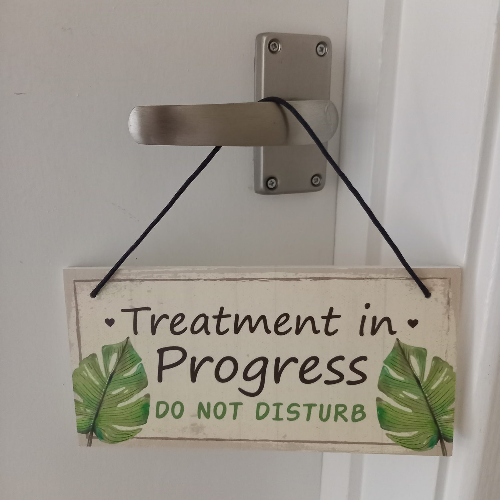 A Treatment in Progress, Do Not Disturb sign on the door